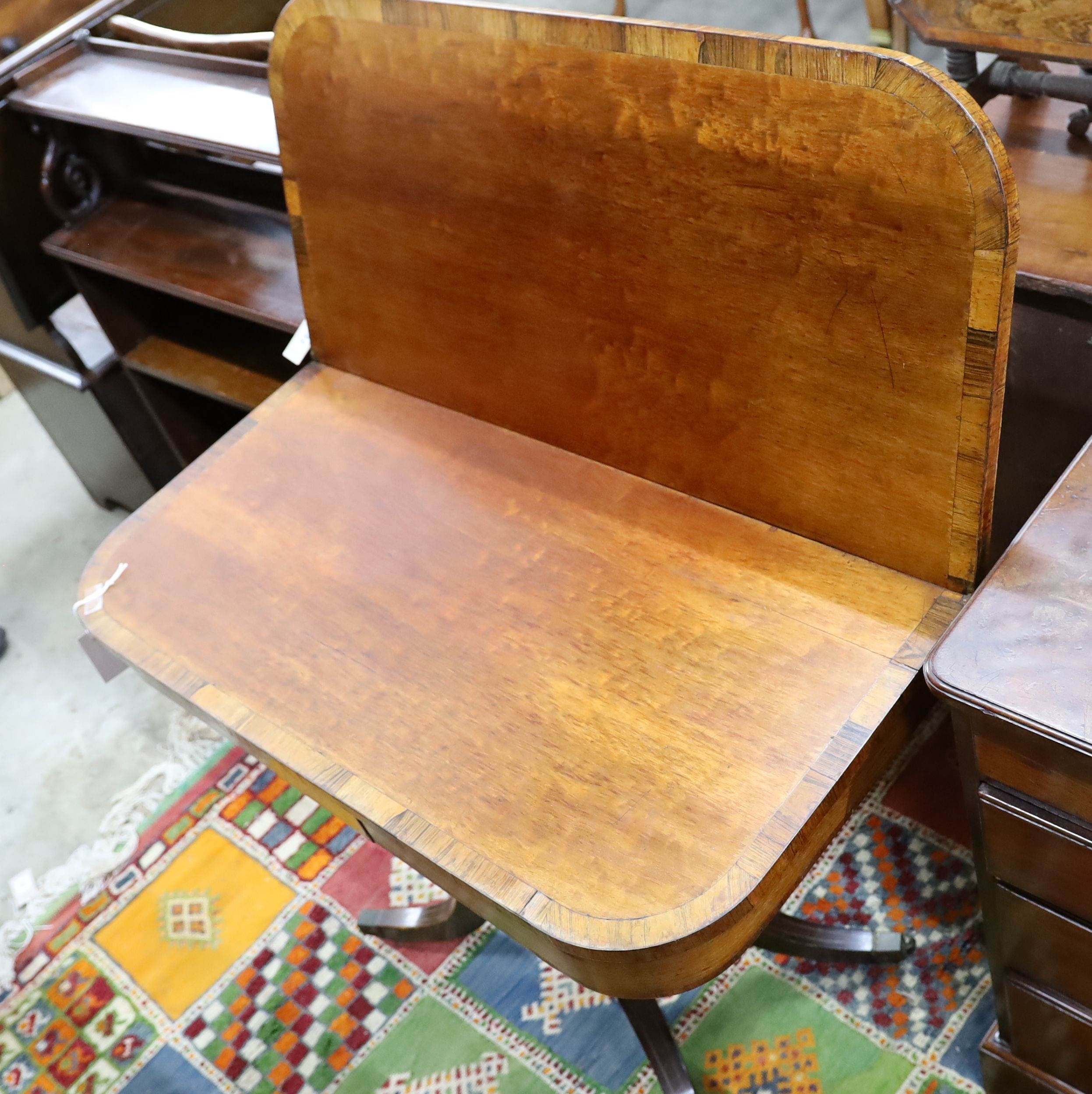 A Regency rosewood banded and mahogany tea table, width 91cm, depth 45cm, height 75cm